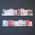 AI created image displaying multiple 100cm standard greeting card rack installed on a wall.