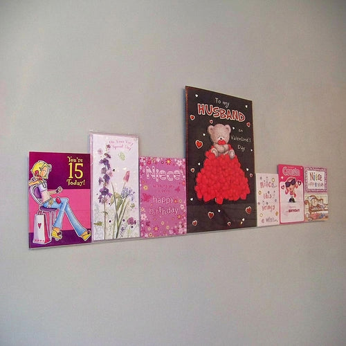 Image displaying 100cm single greeting card (0.5cm capacity) rack installed on wall.