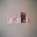 Image displaying 94cm single greeting card (0.5cm capacity) rack installed on wall.