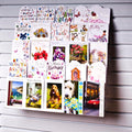 Image displaying 5 tier 60cm greeting card rack installed on white slatwall. 