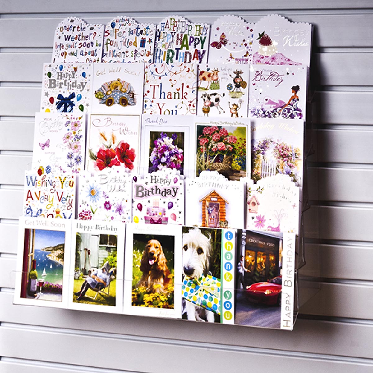 Image displaying 5 tier 60cm greeting card rack installed on white slatwall. 