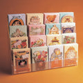Image displaying 4 tier greeting card display on a counter.